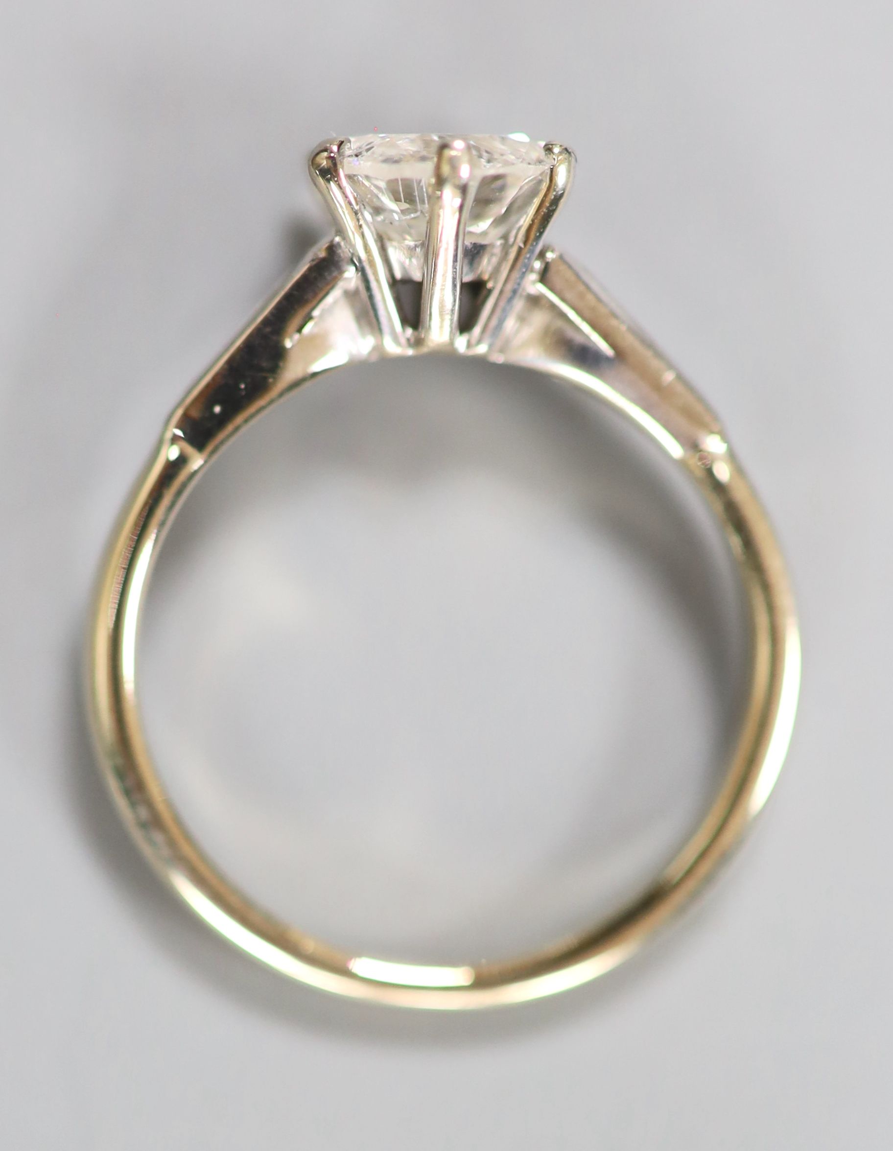 A modern 18ct white gold and solitaire diamond ring, size L, gross 3 grams,